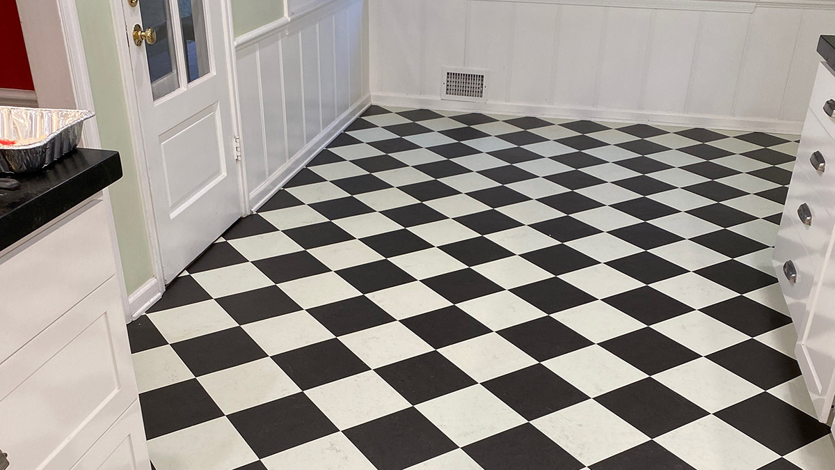 Black and white VCT flooring in commercial kitchen – Forbo brand tiles